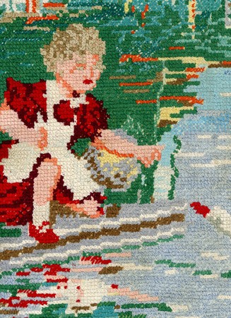 Fragment of vintage embroidery with schoolgirl feeding two swansの写真素材