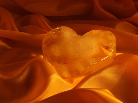 Ice heart on peachy silk     の写真素材