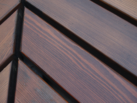 Wooden bench shooted from the narrow angleの写真素材