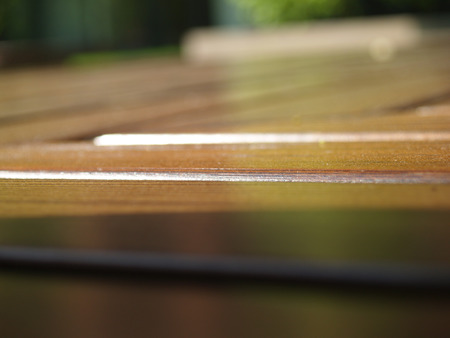 Wooden bench shooted from the narrow angleの写真素材