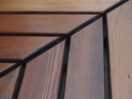 Wooden bench shooted from the narrow angleの写真素材