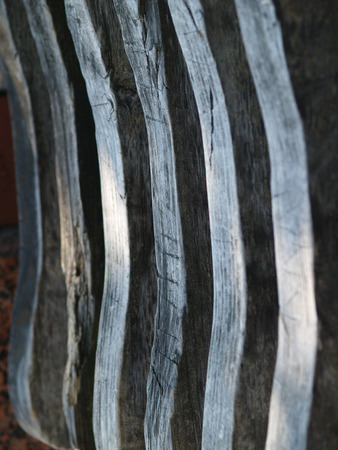 details of wooden bench in summer lightningの写真素材