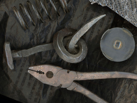 Rusty old iron objects against black old carbon paperの写真素材