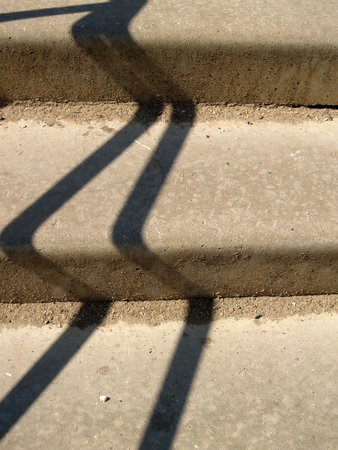 Shadows on a surface of concret stairsの写真素材