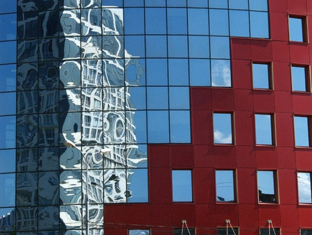 Distorted reflection of an office  glass windows of another buildingの写真素材