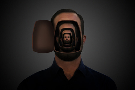 Man inside several heads.の写真素材