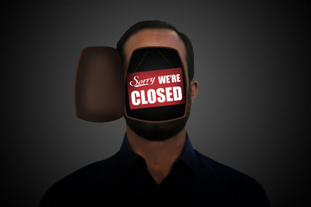 "Sorry we're closed" sing inside an opened man's head.の写真素材