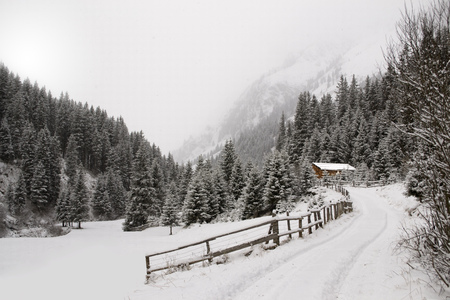 Mountain retreat in snowy weather, in the italian Alps.の写真素材