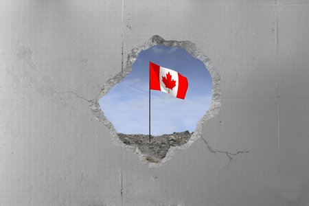 Canadian Flag behind a concrete wall.の写真素材