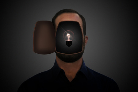 Light bulb inside an opened man's head.の写真素材