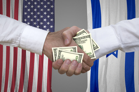 100 dollar bills handshake with USA and Israeli flags background.の写真素材