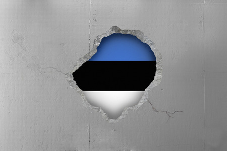 Estonian flag behind a concrete wall.の写真素材