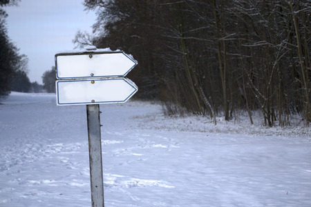 Blank sign in a park snow covered.の写真素材