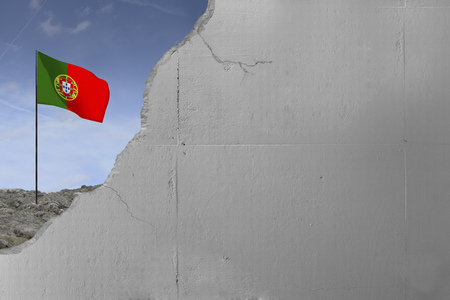 Portugal's flag behind a concrete wall.の写真素材