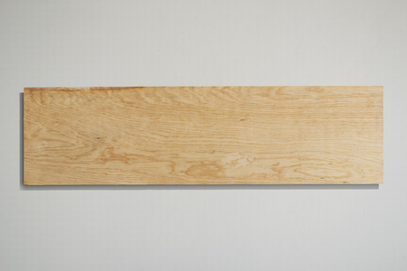 Rectangular plywood sign with grey background.の写真素材
