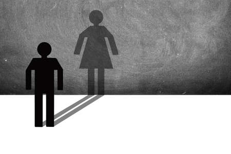 The figure of a man changes into a woman in the shadows. Concept for the third sex.Woman trapped in...