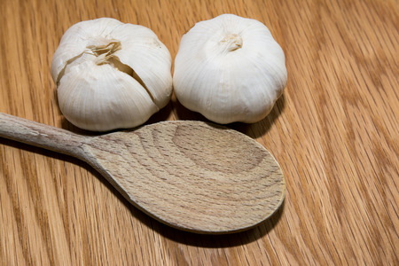 Garlic with wooden spoonの写真素材