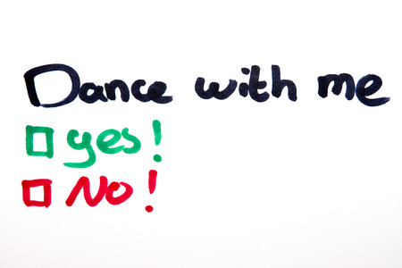 Dance with me, yes or no written on piece of paper