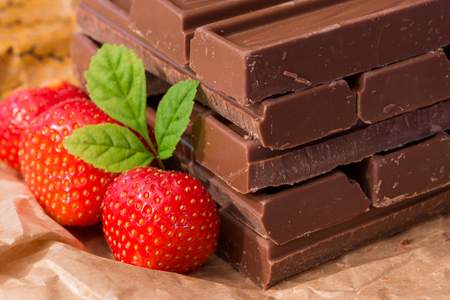 Chocolate stacked with strawberries and mintの写真素材