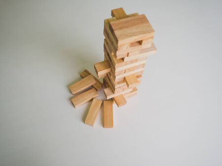 Wood block tower with architecture model, Planning Alternative Risk and Strategy in Business...