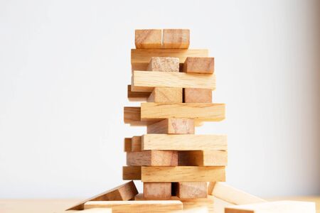 Wood block tower with architecture model, Planning Alternative Risk and Strategy in Business concept.の写真素材