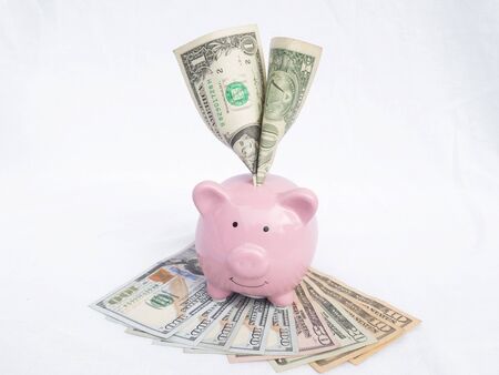 pink piggy bank with dollars bank note, Saving money for future plan and retirement fund concept.の写真素材