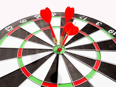 Target with three red dart focus on bull's eye, Setting challenging business goals And ready to achieve the goal with teamwork concept.の写真素材