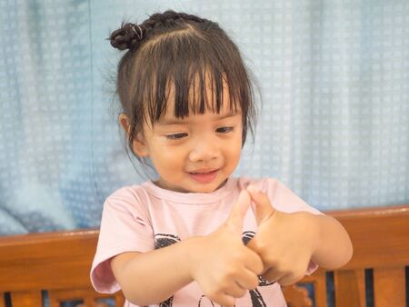 The cuteness, the freshness of the little girl, and the poses for taking pictures.の写真素材