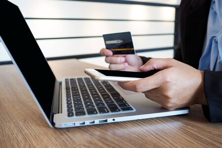 Business woman consumer spending via credit card and internet banking for shopping onlineの写真素材