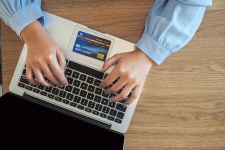 Business woman consumer spending via credit card and internet banking for shopping online.