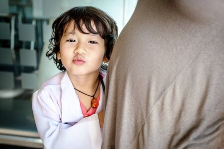 Photo of kid doctor with pregnant mother in the office.の写真素材