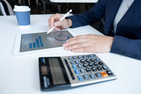 Business woman analyzed the chart for Setting challenging business  goals And ready to achieve the...
