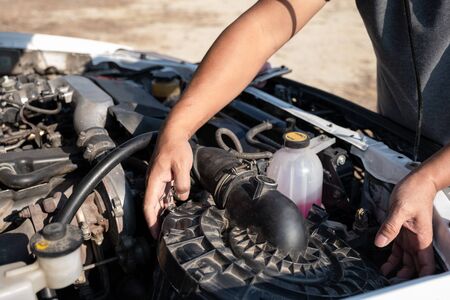 The driver is checking the car before traveling, safety first concept.の写真素材