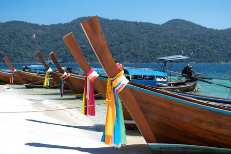 Long tail boat sailing through the blue sea with blue sky background.の写真素材