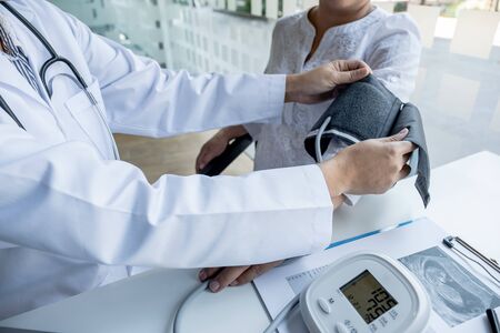 The doctor check the health and advise pregnancy to pregnant women.の写真素材