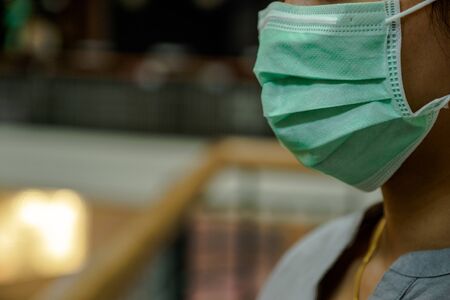 The women wearing the mask, Make a symbol  fight in disaster covid19.の写真素材
