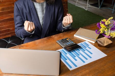 Picture of business woman pretending wisp hand because work success.