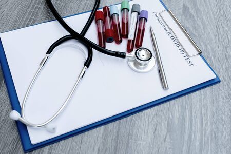 The picture of blood tube of coronavirus test and stethoscope in white background.の写真素材