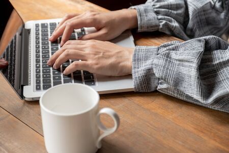 Picture of business woman working at home with her laptop.