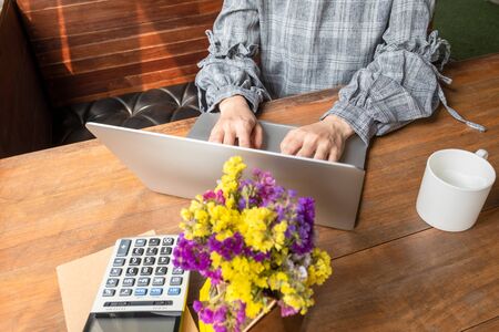 Picture of business woman working at home with her laptop.