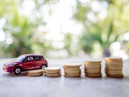 Red cars with golden coins pile, business cars, Insurance, rent concept.