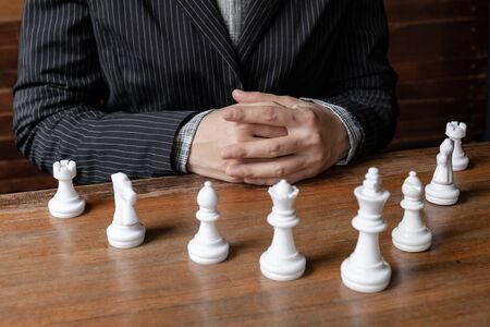 Business women and chesses with wooden background, challenges planning business strategy to success concept.の写真素材