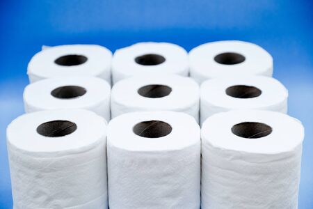 Toilet paper isolated on a blue background.の写真素材