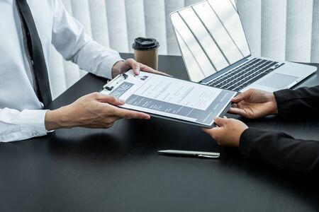 Office executives are interviewing job applicants in the meeting room.の写真素材