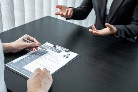 Office executives are interviewing job applicants in the meeting room.の写真素材