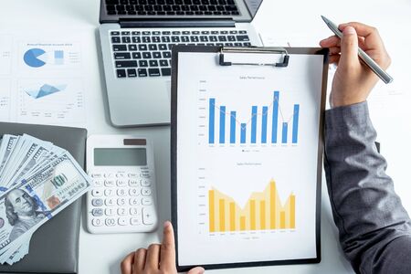 Business woman analyzed the chart for Setting challenging business goals and ready to achieve the...