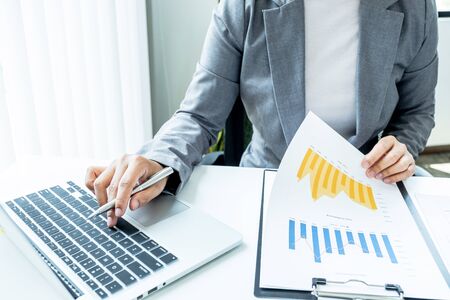 Business woman analyzed the chart for Setting challenging business goals and ready to achieve the...