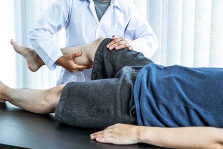 Physical therapy is doing leg therapy for patients in the hospital.
