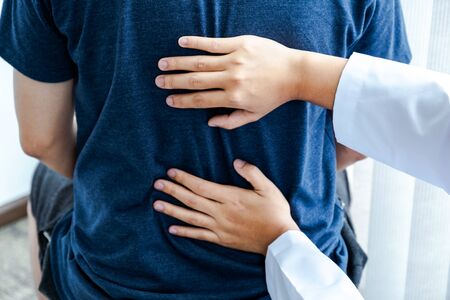Physical therapy is doing back therapy for patients in the hospital.