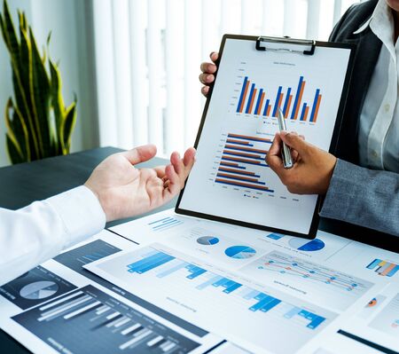 businessmen and businesswomen team meeting to plan strategies to increase business income. Have a...